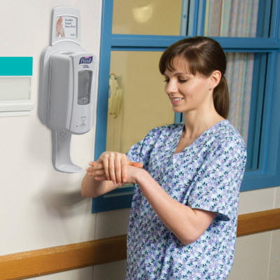 PURELL Sanitizer Nurse using Dispenser